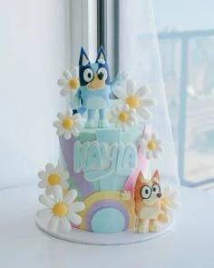 Bluey and Bingo themed 1-tier fondant cake with pastel rainbow and daisy decorations