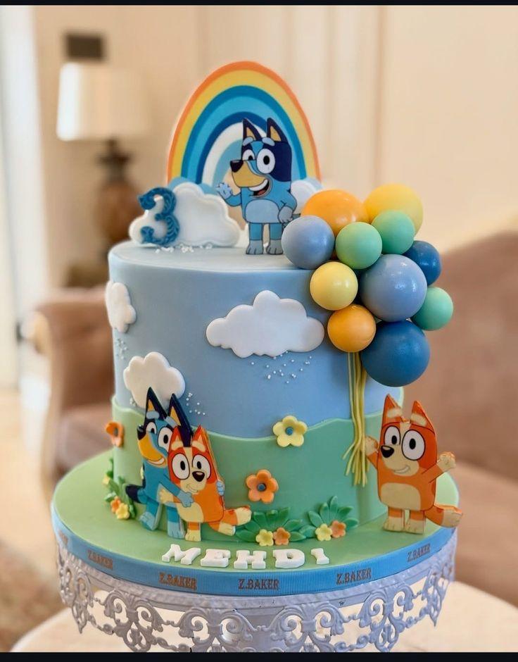 Bluey Rainbow 1 Tier Fondant - blue, white, red theme with rainbow and white clouds