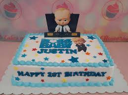 Boss Baby 1st birthday Rectangle - red theme with Boss Baby toy with briefcase and printout of 'BOSS BABY JUSTIN' text