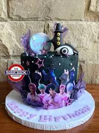 Black 1-tier K-pop themed birthday cake with purple accents, character printouts, and a black 3D figure topper.