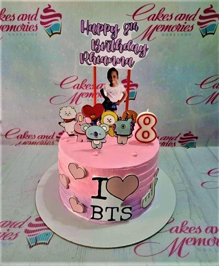 Pink and purple gradient BTS themed birthday cake with BT21 character toppers and a photo of the birthday girl.
