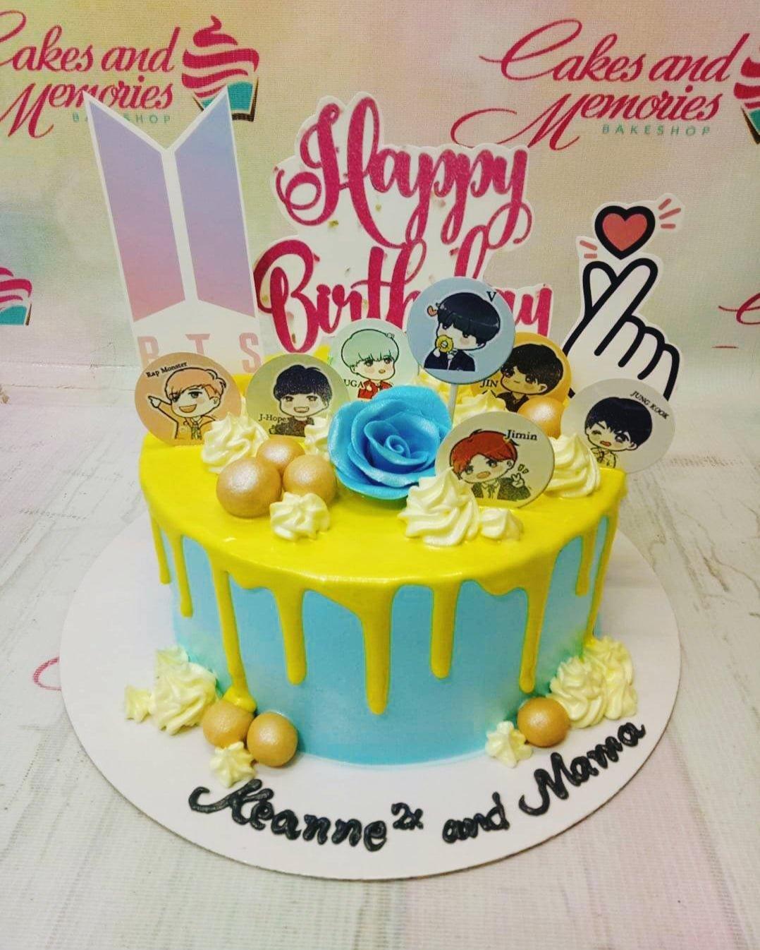 Light blue 1-tier BTS K-pop birthday cake with yellow drip, yellow icing rosettes, and printed character toppers.