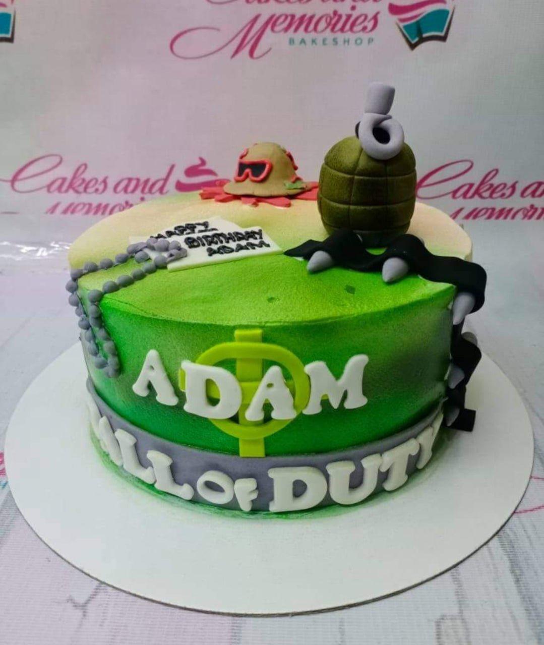 Call of Duty themed green gradient fondant cake with a 3D fondant grenade, military hat, and dog tags.