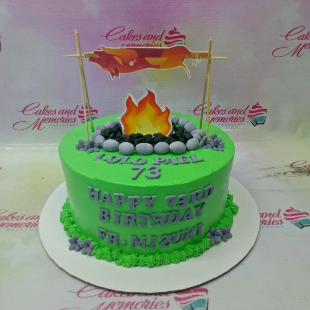 Green camping themed birthday cake for Lolo Pael's 73rd birthday featuring a lechon printout and a fondant campfire.