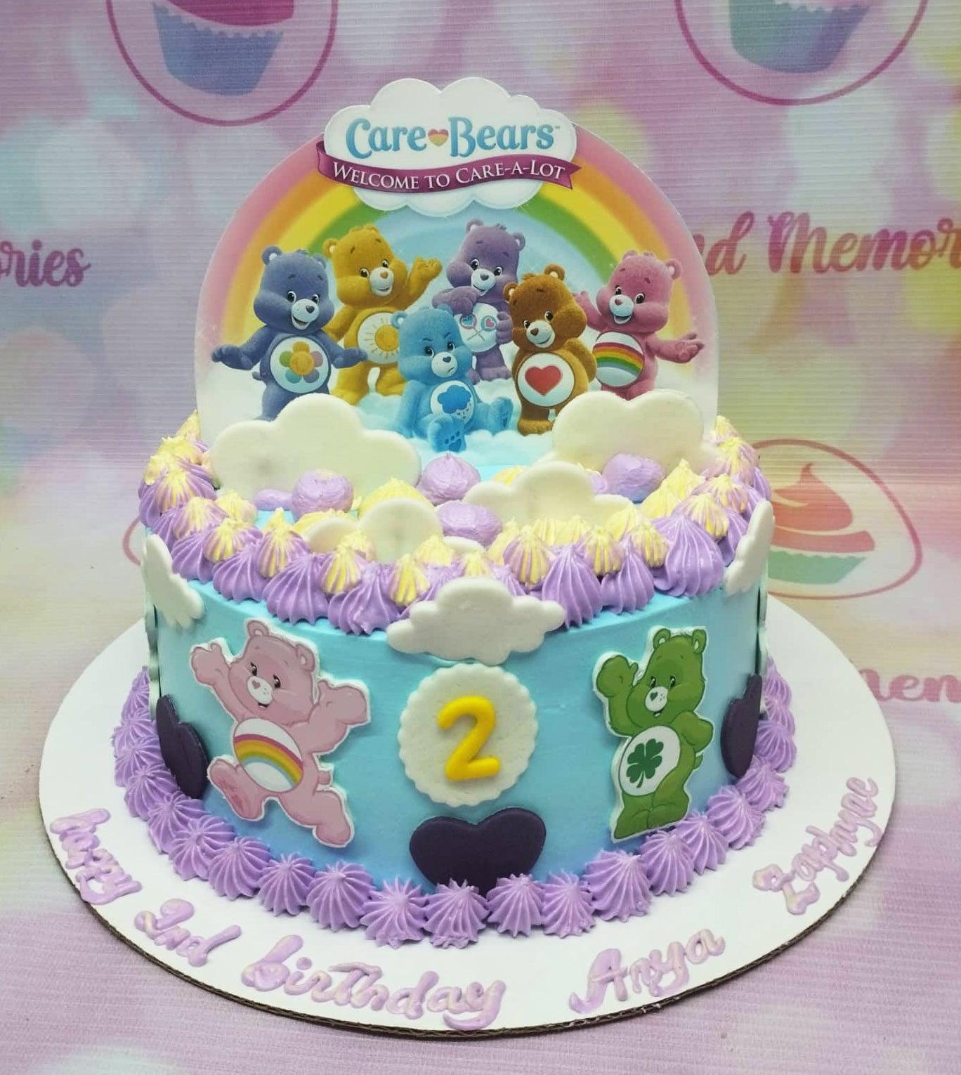 Light blue Care Bears birthday cake with rainbow printout topper, fondant clouds, and purple icing rosettes.