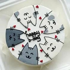 White bento cake featuring five hand-drawn grey and white cats with red hearts and a Happy B-day message.