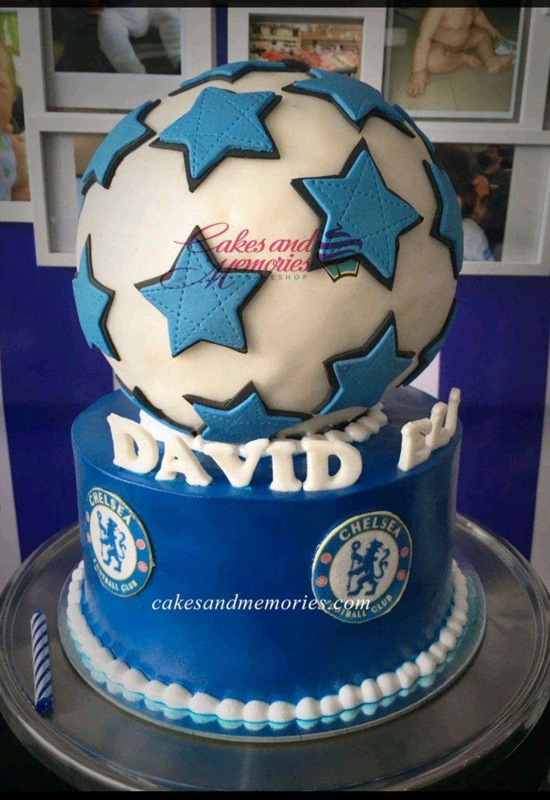 Blue Chelsea FC themed birthday cake with a large 3D soccer ball topper and Chelsea logo printouts.