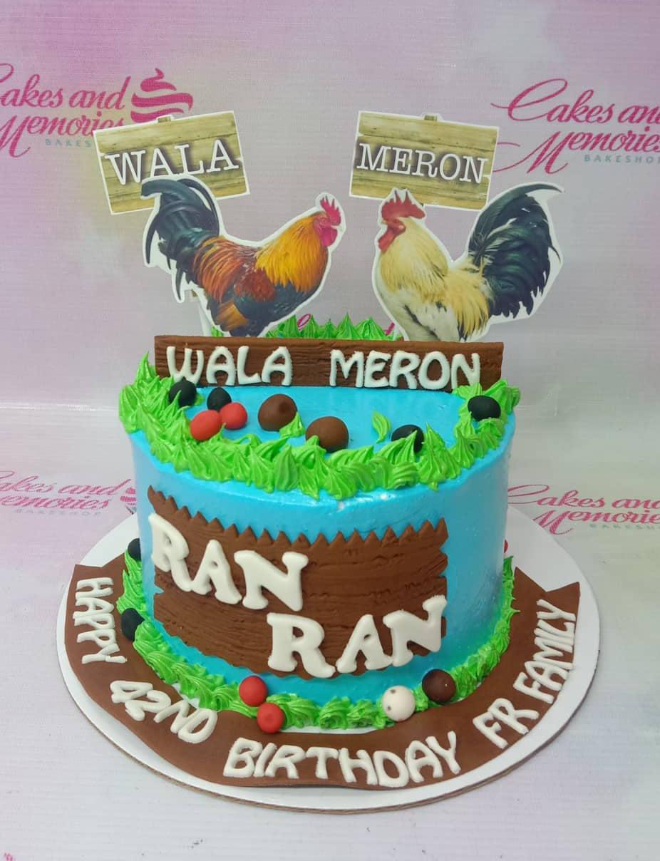 Light blue cockfighting themed birthday cake with rooster printouts and brown gumpaste panels
