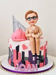 construction pink 1 Tier Fondant - brown, pink, white theme with Female figurine with glasses and brown suit, sitting on c...