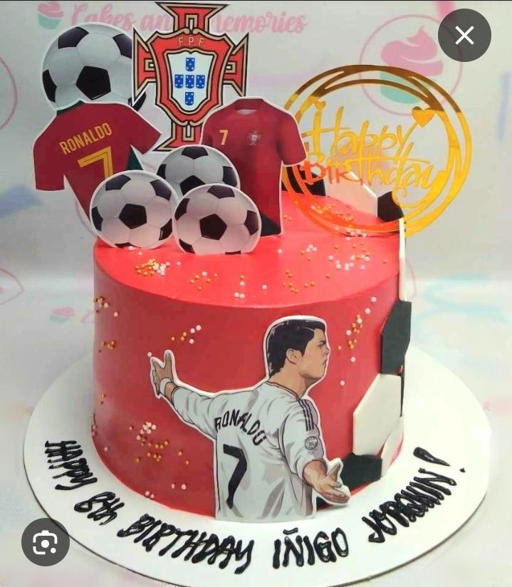Red single tier soccer cake with Cristiano Ronaldo and Portugal jersey printouts and soccer balls