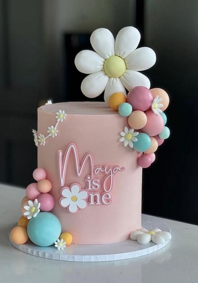 daisy birthday 1 Tier - white theme with large white daisy and colorful fondant spheres