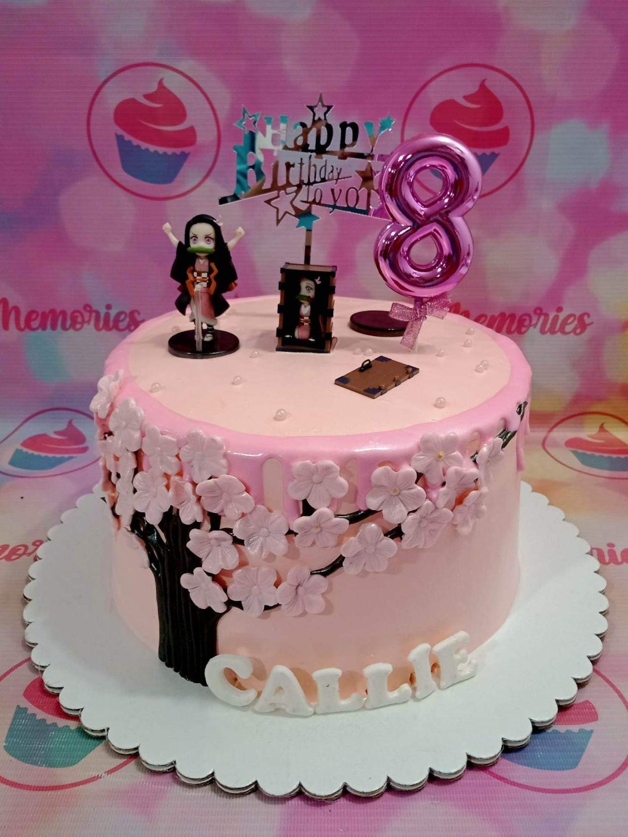 Pink Demon Slayer Nezuko themed birthday cake with cherry blossom tree design, pink drip, and character toppers.