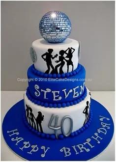 Three-tier blue and white disco themed birthday cake with a silver disco ball topper and black dancing silhouettes.