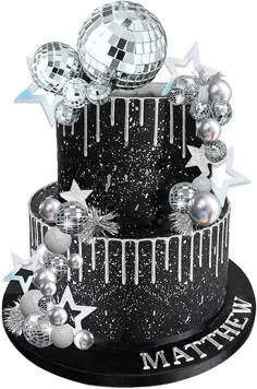 Black 2-tier disco themed cake with silver drip, silver stars, and various sized disco ball toppers.
