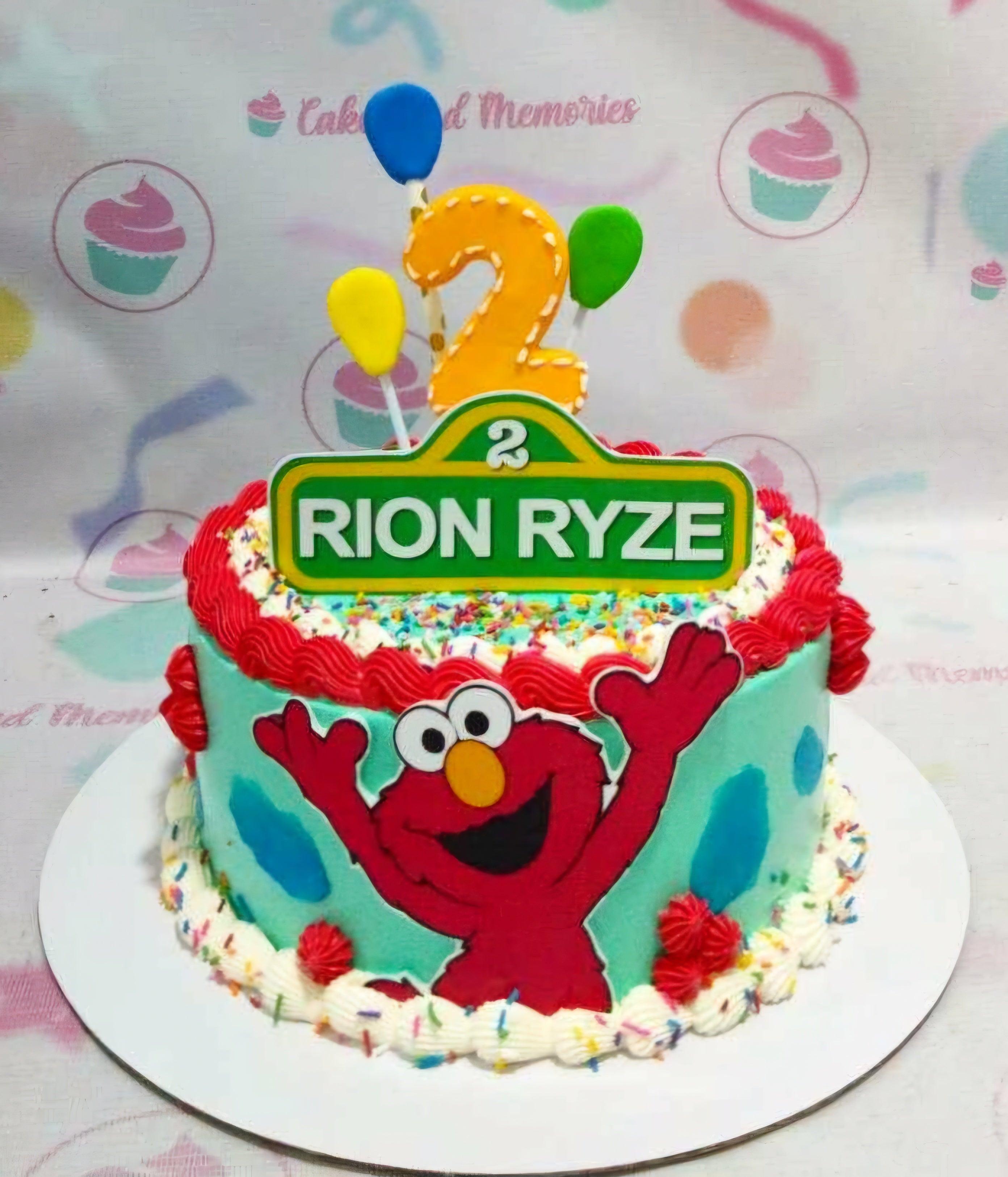 Elmo Sesame Street themed birthday cake with teal icing, red borders, and a custom name topper for Rion Ryze.