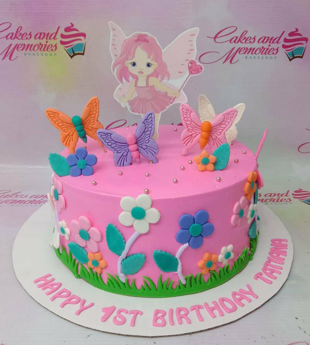 Fairy Garden 1 Tier - pink, purple, orange theme with fairy character with pink hair and wings and fondant butterflies in ...
