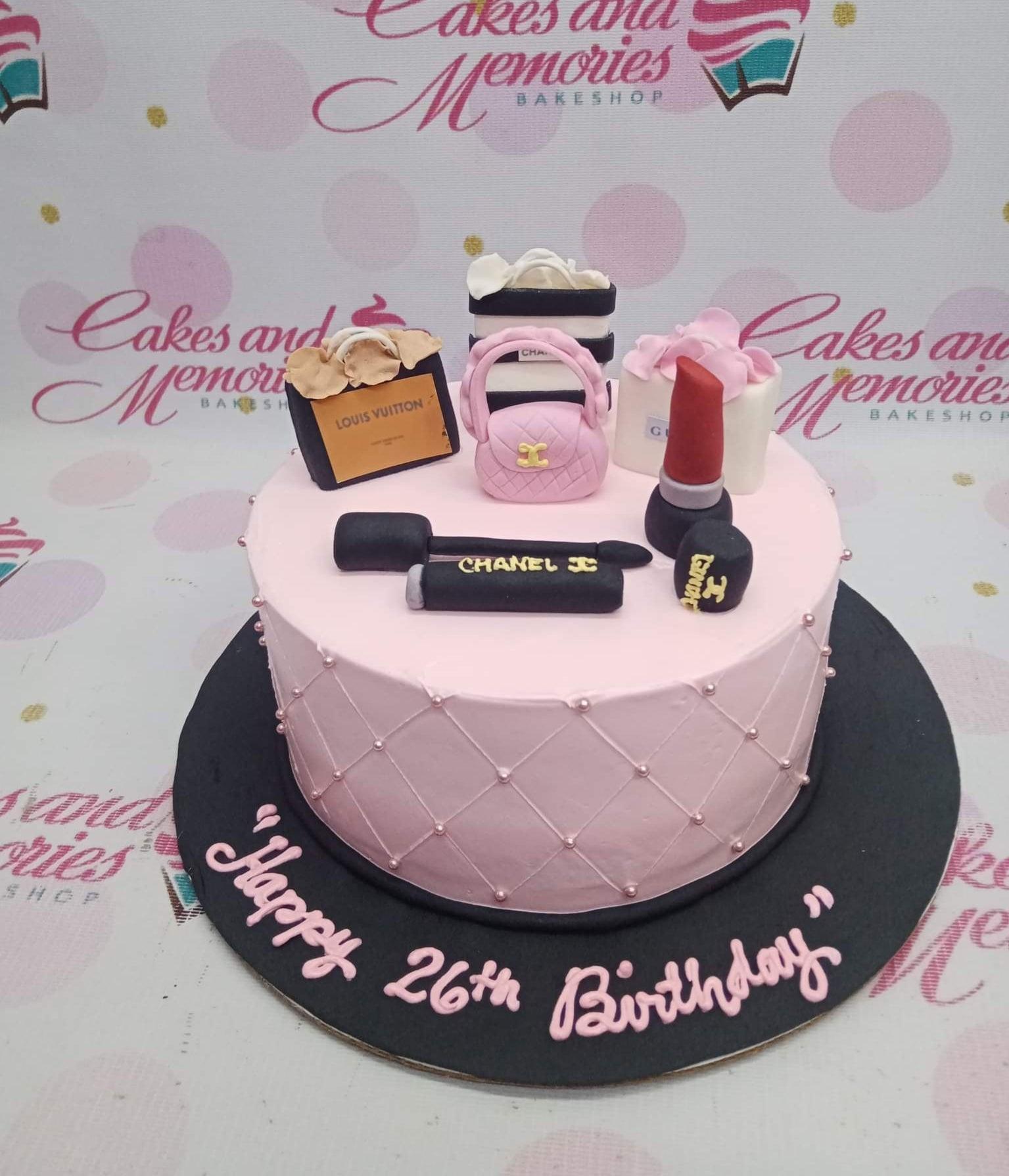 Pink 1-tier fashion themed birthday cake with fondant makeup and luxury shopping bag toppers on a black base board.