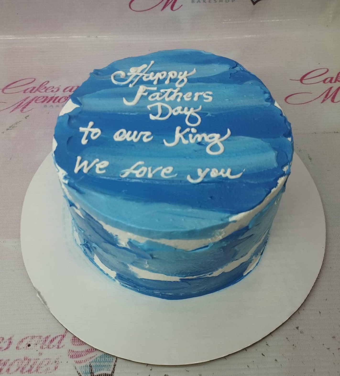 Blue and white palette knife textured cake for Father's Day with white icing message
