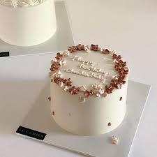 Cake 1 Tier - white, red theme with scattered edible floral/leaf pieces