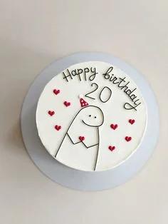 White bento cake with a hand-drawn Flork character wearing a red party hat and surrounded by small red hearts.