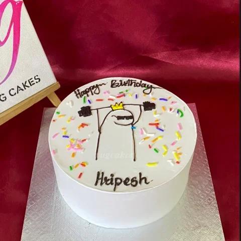 White bento cake with a hand-drawn Flork character lifting weights and colorful sprinkles.