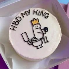 White bento cake with a hand-drawn Flork character wearing a gold crown sitting on a toilet, featuring the message HBD MY KING.
