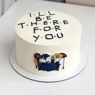 White minimalist Friends TV show themed cake with 'I'll Be There For You' message and character printout.