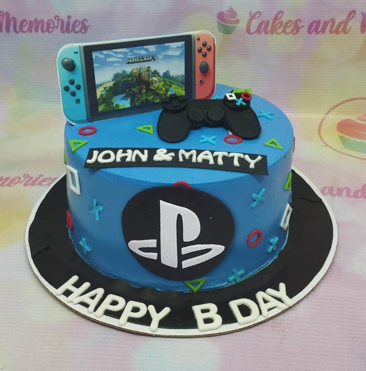 Blue PlayStation and Nintendo Switch themed birthday cake with a 3D controller and gaming icons.