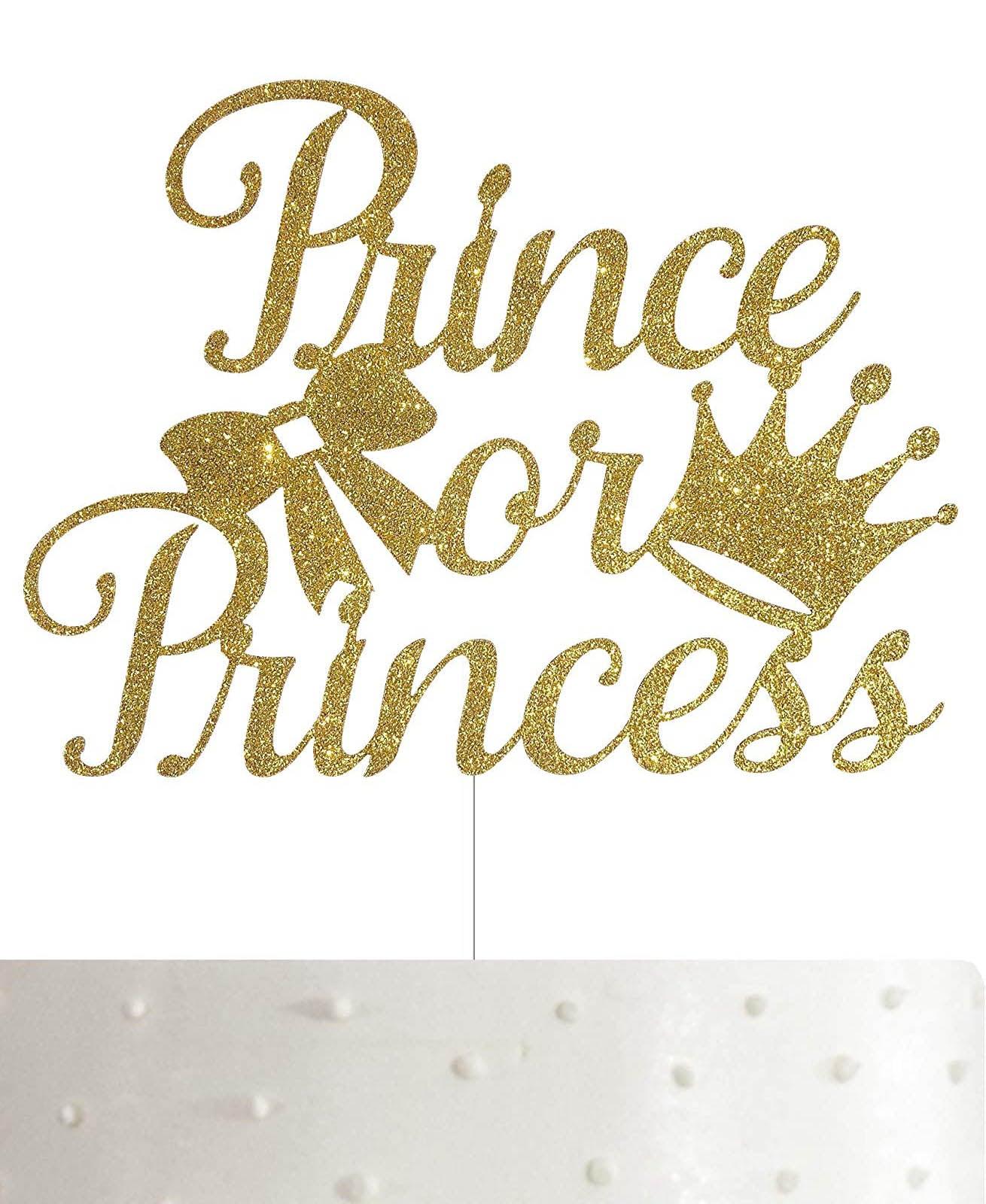 Gold glitter Prince or Princess gender reveal cake topper on a white cake with pearl sprinkles.