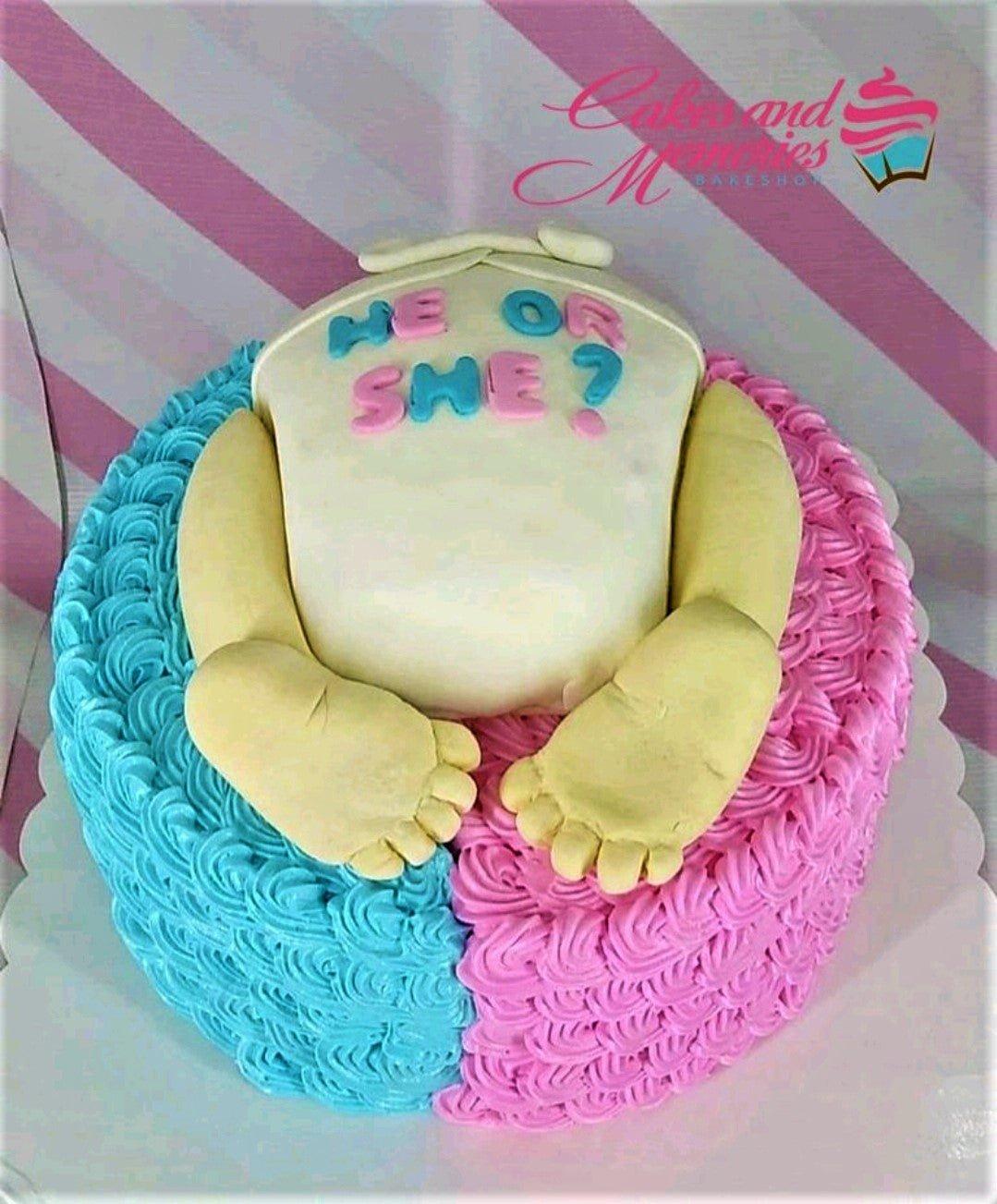 Gender reveal cake with pink and blue icing rosettes and a 3D fondant baby bottom topper with 'He or She?' message.