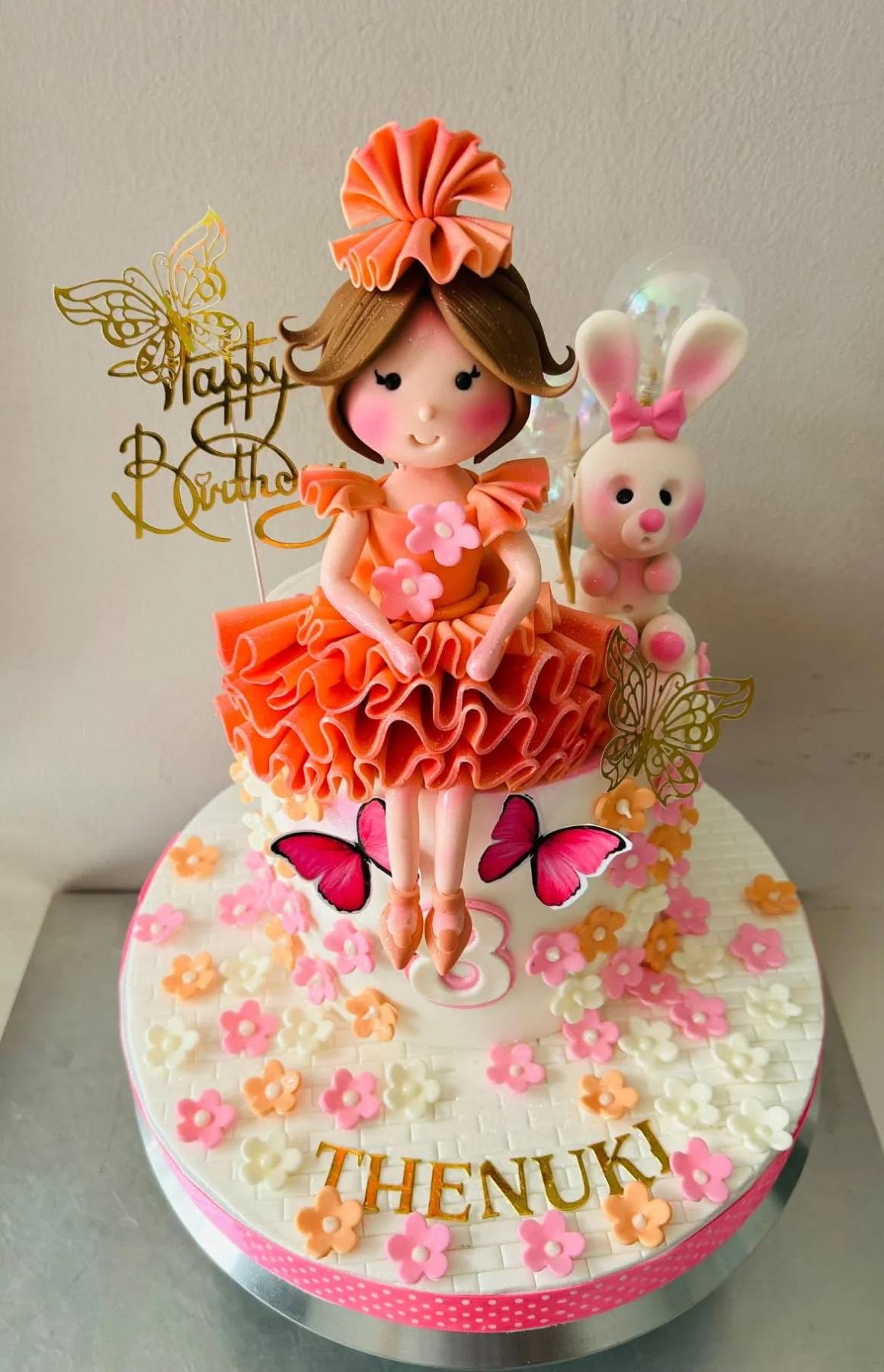 girl bunny birthday 1 Tier Fondant - white, orange, pink theme with girl in orange dress and pink orange and white flowers