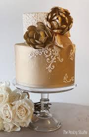 Gold Floral 2 Tier Fondant - white, gold theme with Large gold sugar flowers and Intricate white lace icing pattern
