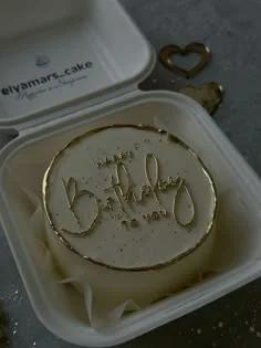 White bento cake with gold 'Happy Birthday to you' message and gold painted rim in a white box.
