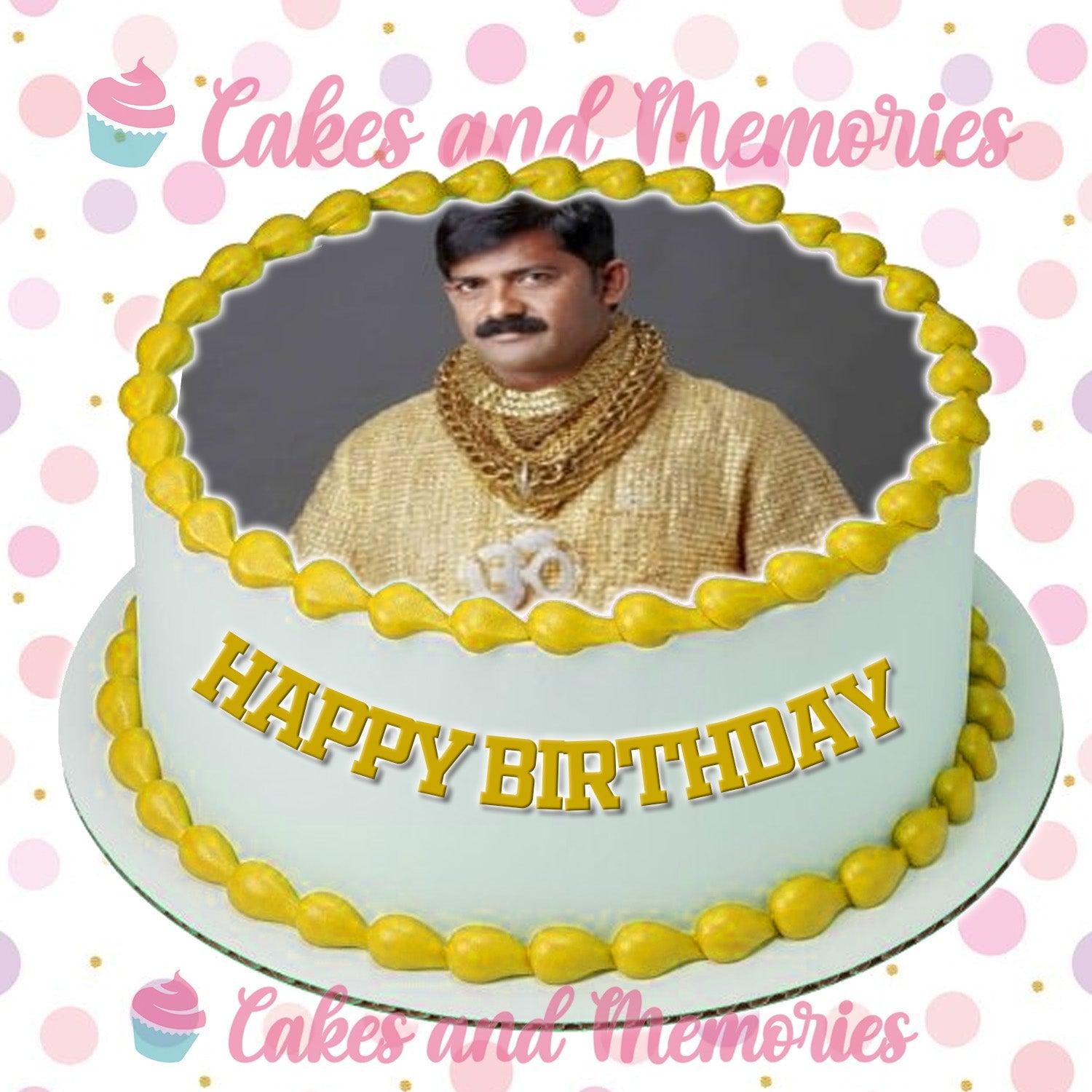 White round cake with a large edible photo of a man in gold clothing, yellow icing borders, and a gold Happy Birthday message.