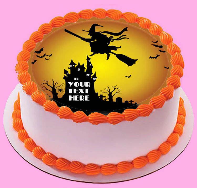 Halloween themed cake with orange icing borders and a central witch and haunted house printout topper.