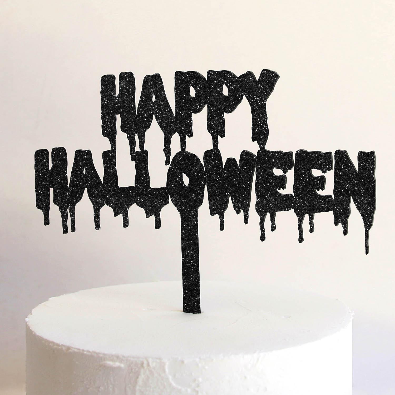 White minimalist cake with a black glittery Happy Halloween dripping font topper.