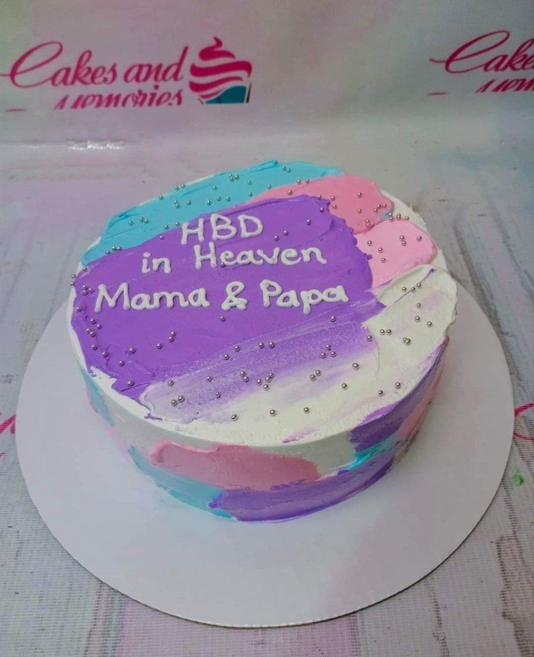 Bento cake with purple, pink, and blue palette knife icing, silver dragees, and a message for Mama and Papa.