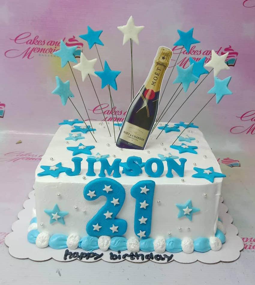 White square birthday cake for Jimson's 21st birthday featuring a Moet champagne bottle printout and blue and white stars.