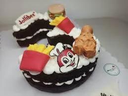 Jollibee themed chocolate bento cake with fondant chicken, fries, and burger toppers