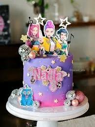 Purple and pink gradient cake with K-pop character printouts, disco balls, and glittery stars for Nadia's 8th birthday.