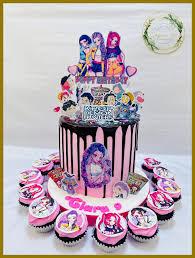 Pink 1-tier cake with chocolate drip and Kpop anime character printouts on top and side