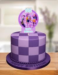 Purple and lavender checkered fondant cake with a Kpop group printout topper and beaded border