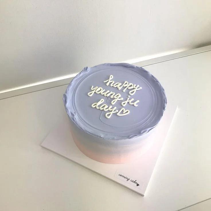 Minimalist lavender and peach bento cake with white piped icing message and heart detail.