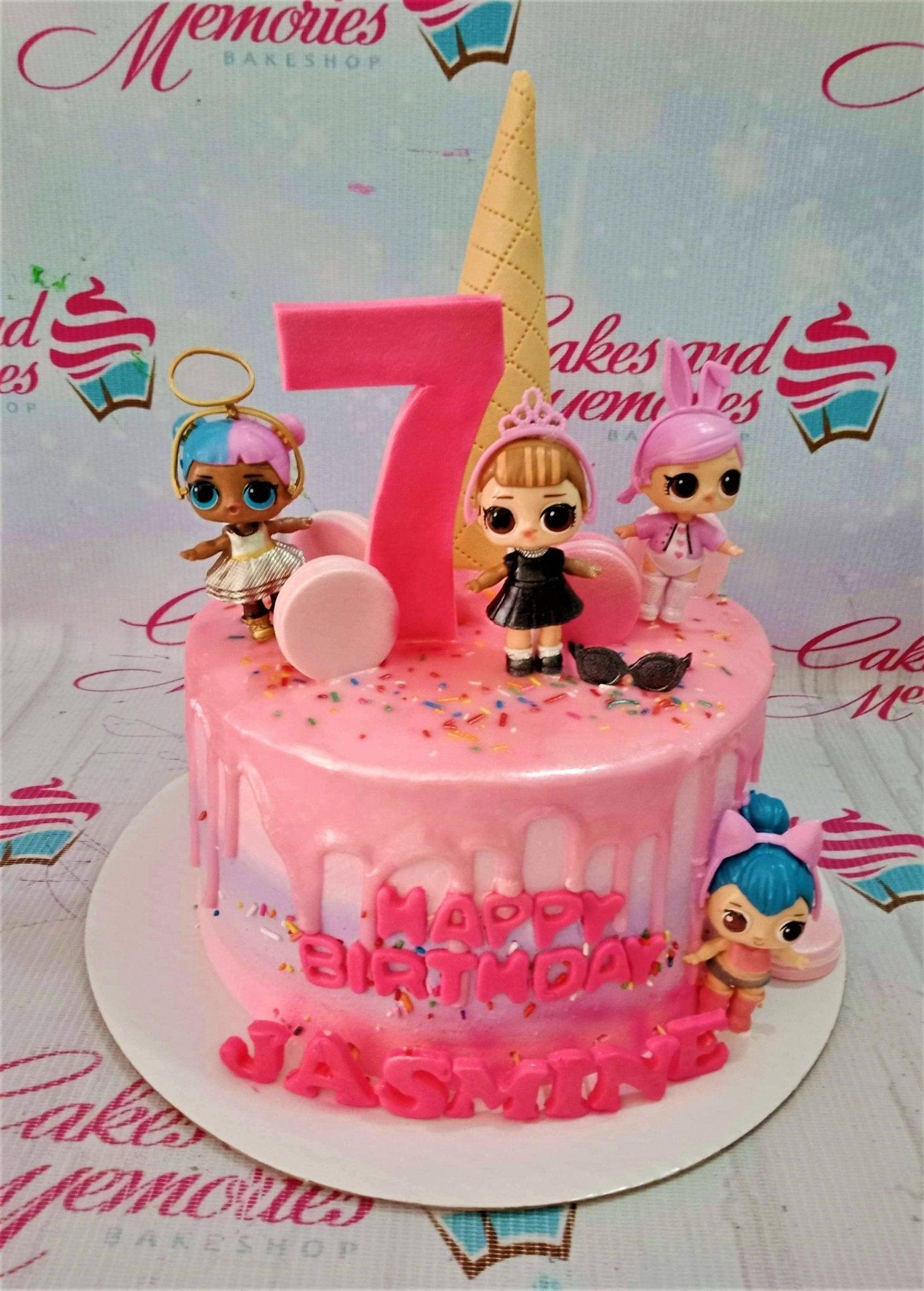 Pink LOL Surprise themed birthday cake with pink drip, ice cream cone topper, and LOL dolls.