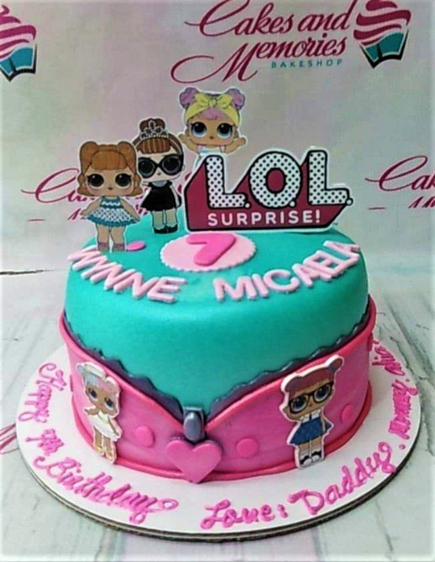 Teal and pink LOL Surprise themed birthday cake with character printouts and a zipper design.
