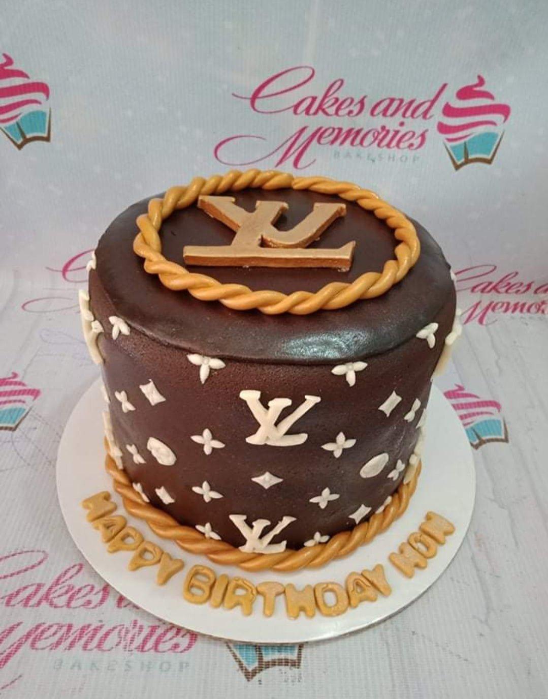 Brown Louis Vuitton themed fondant cake with gold rope borders and white monogram patterns.