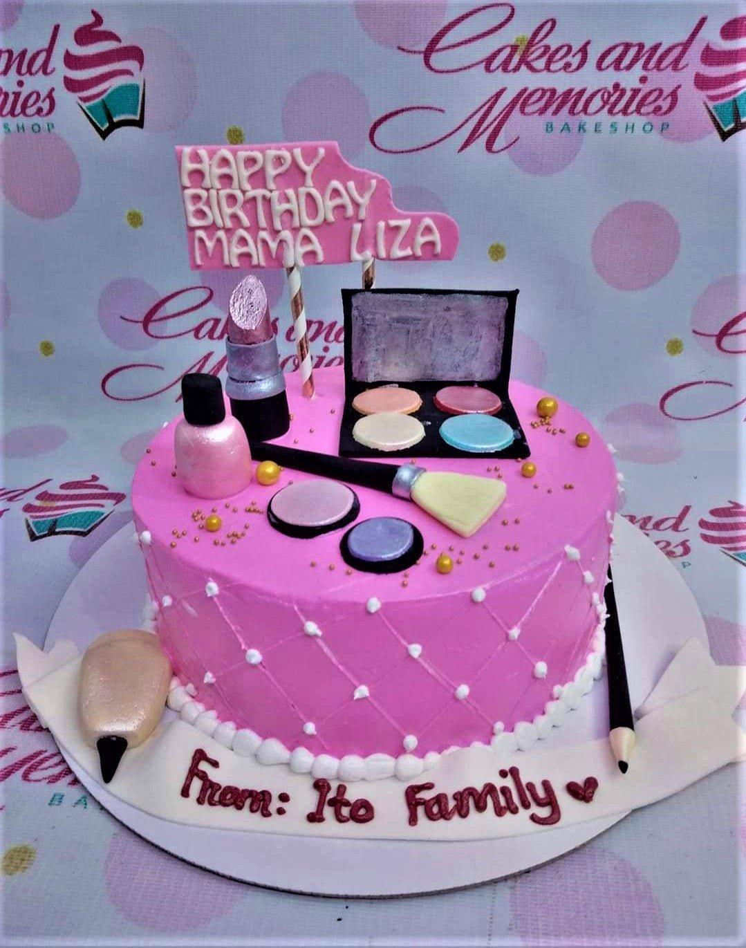 Pink makeup themed birthday cake for Mama Liza with fondant lipstick, eyeshadow palette, and makeup brush toppers.