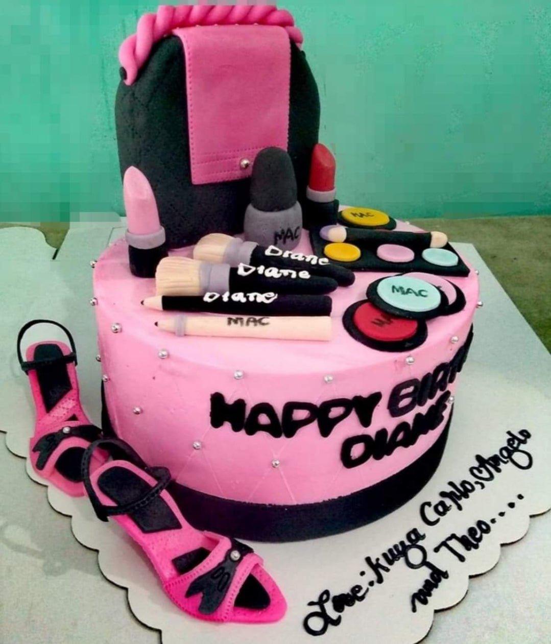 Pink and black makeup themed cake with fondant lipstick, brushes, and high-heeled shoes.