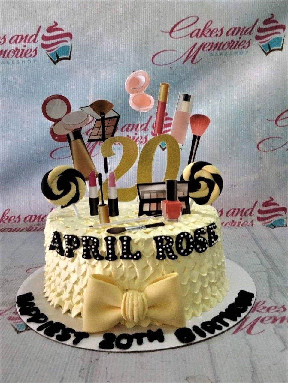 White 1-tier makeup themed birthday cake with yellow icing ruffles, makeup printouts, and a large gold glitter number 20 topper.