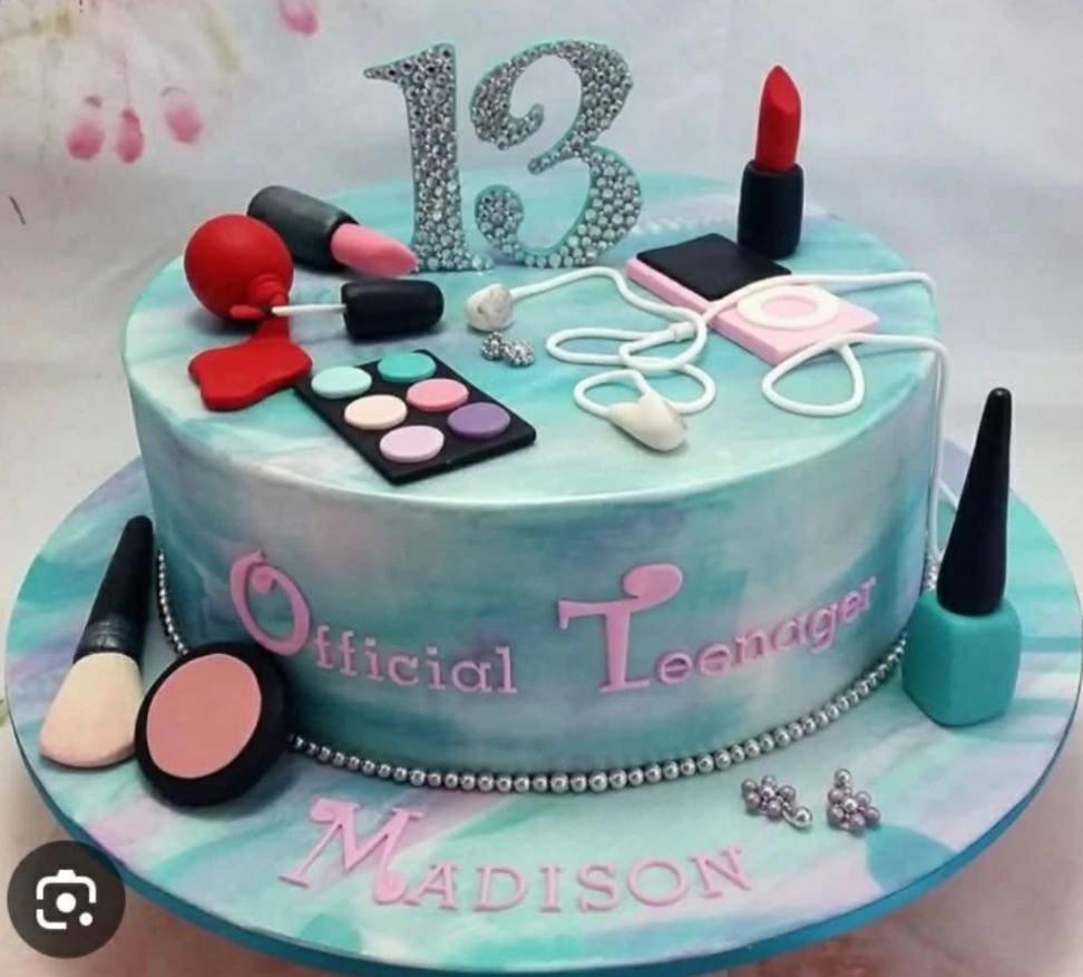 Teal and purple watercolor fondant cake with makeup and headphone toppers for a 13th birthday celebration.